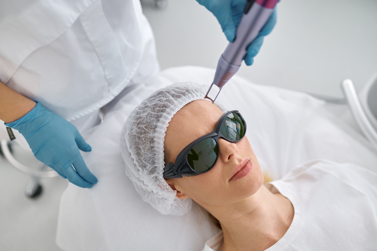 cosmetologist-preparing-client-for-facial-laser-ca-2022-12-03-22-29-08-utc-resized